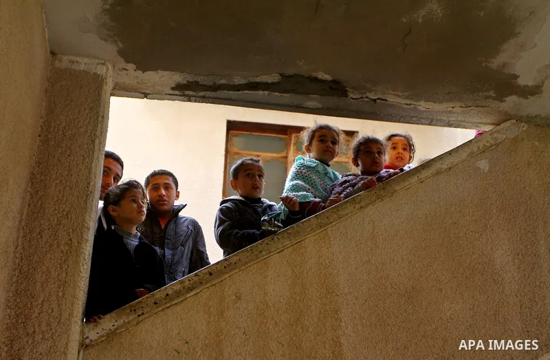 Relatives mourns during the funeral of Palestinian Bahjat Al-Zalan, who was killed in a blast from an Israeli air strike on a nearby Hamas training camp in Gaza City December 9, 2011. Violence across the Israeli-Gaza bor...