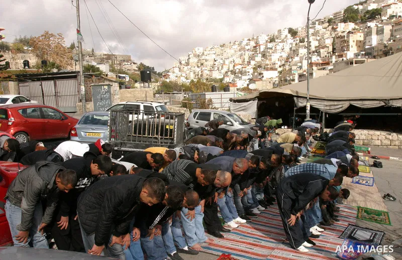 Palestinians attend Friday prayers at the protest tent in the Silwan neighborhood in East Jerusalem on Dec. 9,2011 as Palestinian protesters gather for a demonstration. Photo by Mahfouz Abu Turk
