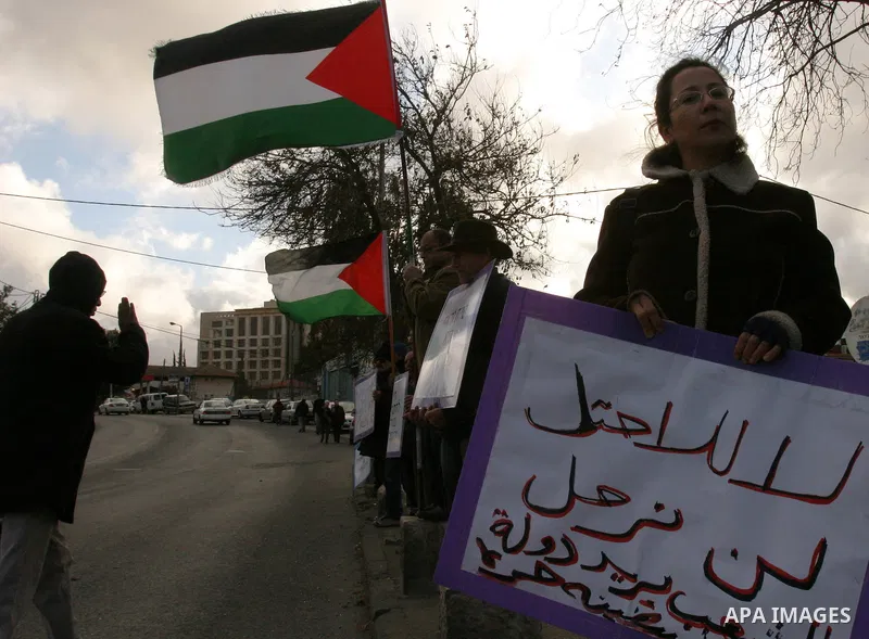 Demonstrators take part in a protest against a Jewish settlement in the Sheikh Jarrah neighborhood in East Jerusalem on Dec. 9, 2011. Photo by Mahfouz Abu Turk