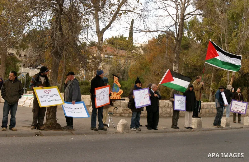Demonstrators take part in a protest against a Jewish settlement in the Sheikh Jarrah neighborhood in East Jerusalem on Dec. 9, 2011. Photo by Mahfouz Abu Turk
