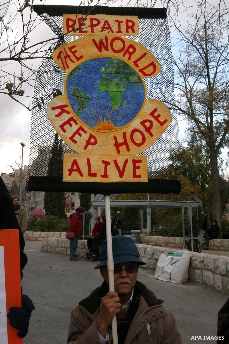 Demonstrators take part in a protest against a Jewish settlement in the Sheikh Jarrah neighborhood in East Jerusalem on Dec. 9, 2011. Photo by Mahfouz Abu Turk