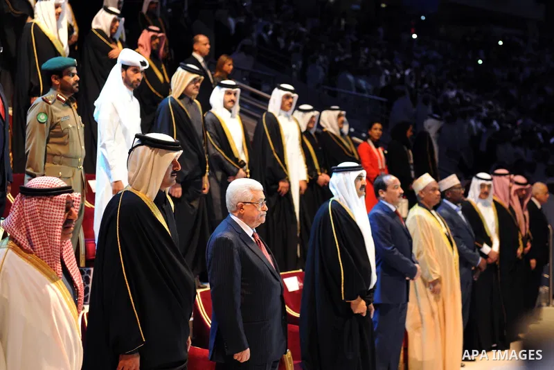Palestinian President Mahmoud Abbas (Abu Mazen) and Qatari Crown Prince Sheikh Tamim bin Hamad bin Khalifa al-Thani applaud during the opening ceremony of the pan-Arab Games in Doha on December 9, 2011. More than 5,000 A...