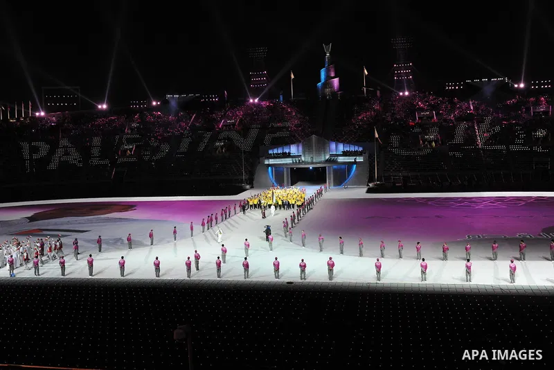 Members of the Palestinian team take part in the opening ceremony of the pan-Arab Games at Sheikh Khalifa stadium in the Qatari capital Doha on December 9, 2011. More than 5,000 Arab athletes are participating in the Ara...