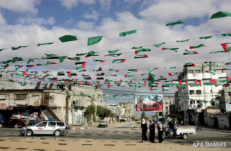 Palestine and Hamas Flags adorn the streets in the preparation of the anniversary of Hamas Islamic movement foundation in refugee camp of Rafah in southern Gaza Strip on December 10, 2011. Photo by Abed Rahim Khatib. Pho...