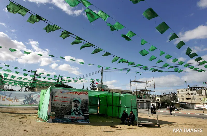 Palestine and Hamas Flags adorn the streets in the preparation of the anniversary of Hamas Islamic movement foundation in refugee camp of Rafah in southern Gaza Strip on December 10, 2011. Photo by Abed Rahim Khatib. Pho...