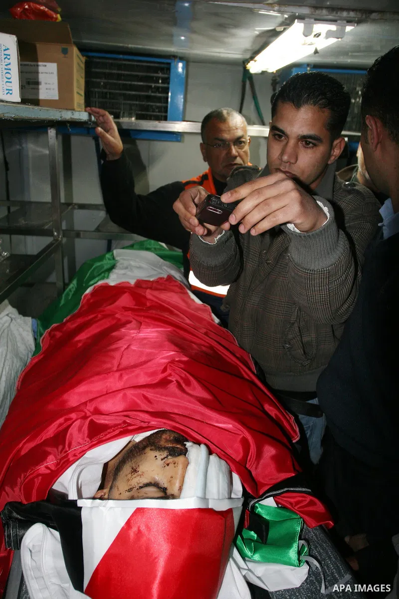 The body of Mustafa Tamimi is seen at the morgue of Ramallah Hospital in the West Bank city of Ramallah, Saturday, Dec. 10, 2011. Tamini, 28, was hurling rocks at an Israeli military vehicle on Friday in the West Bank vi...