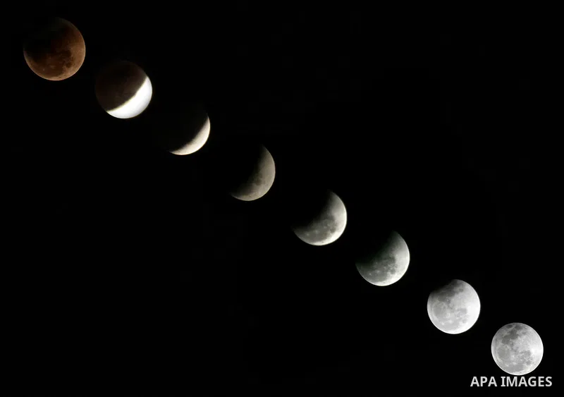 The Earth casts its shadow across the moon's surface during a lunar eclipse in Rafah, in the southern of Gaza Strip on Dec. 10, 2011. This is the second total lunar eclipse of the year and the last until 2014. Photo by A...