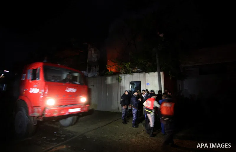 Palestinians Firefighters try to extinguish a fire in a house of Aqel family, following an Israeli airstrike in al- Zaytoun area, in Gaza City, on Dec. 10, 2011. Photo by Mahumd Nassar