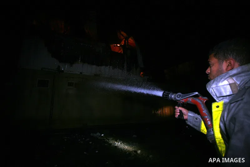 Palestinians Firefighters try to extinguish a fire in a house of Aqel family, following an Israeli airstrike in al- Zaytoun area, in Gaza City, on Dec. 10, 2011. Photo by Mahumd Nassar