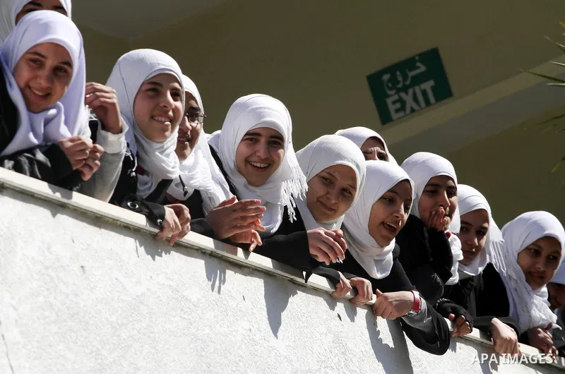 Members of the Palestinian civil defence demonstrate thier skills during a training session following the campaign "your Safety", in school of the girls in Gaza city on Dec. 11, 2011. Photo by Mohammed Asad