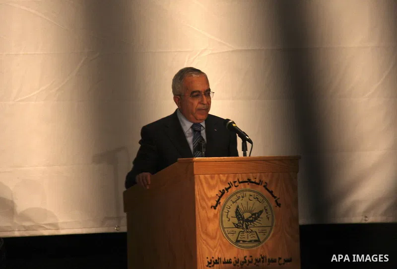 Palestinian Prime Minister Salam Fayyad speaks during a celebration to honor volunteers in al-Najah University in the West Bank city of Nablus, Sunday , Dec. 11, 2011. Photo by Wagdi Eshtayah.