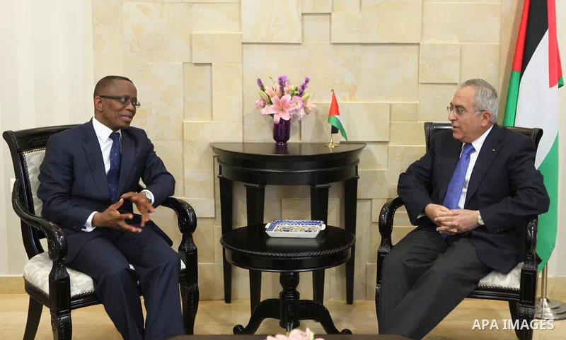 Palestinian Prime Minister, Salam Fayyad, receives representative of South Africa for the Palestinian Authority, Mr. Mel Wangsi Mkalima, in the West Bank city of Ramallah, on Dec. 12, 2011. Photo by Mustafa Abu Dayeh
