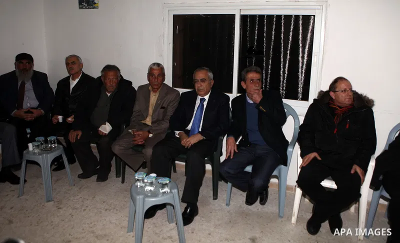 Palestinian Prime Minister, Salam Fayyad, during visits condolences tent for the martyr Mustafa Tamimi in the West Bank city of Ramallah, on Dec. 12, 2011. Photo by Mustafa Abu Dayeh