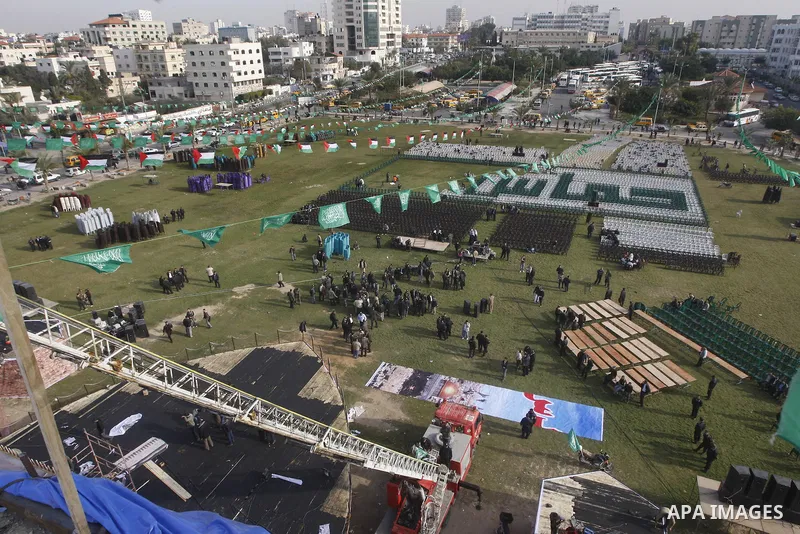 Palestinian members of Hamas prepare the court of "Qatiba" for the celebrations marking the Islamist movement's 24th founding anniversary, in Gaza city on Dec 13,2011. The main celebration will be held on December 14, th...