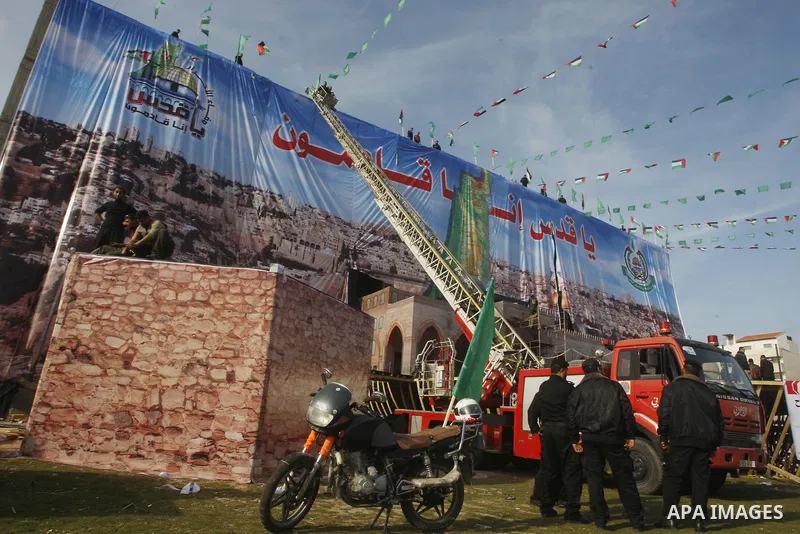 Palestinian members of Hamas prepare the court of "Qatiba" for the celebrations marking the Islamist movement's 24th founding anniversary, in Gaza city on Dec 13,2011. The main celebration will be held on December 14, th...