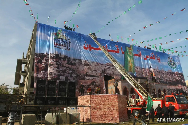 Palestinian members of Hamas prepare the court of "Qatiba" for the celebrations marking the Islamist movement's 24th founding anniversary, in Gaza city on Dec 13,2011. The main celebration will be held on December 14, th...