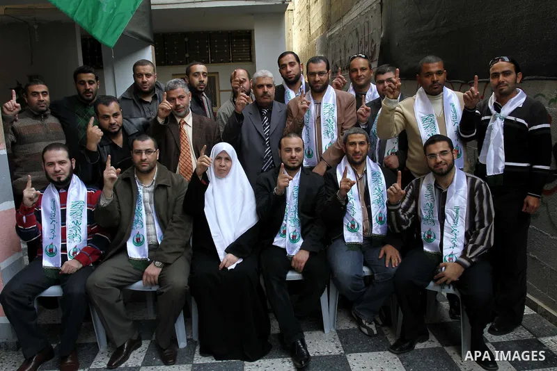 Members of al-Wa'ad team for Nasheed visit the home of Hamas legislator, Mariam Farahat in preparation for the celebrations marking the Islamist movement's 24th anniversary, in Gaza city on Dec. 13,2011. The main celebra...