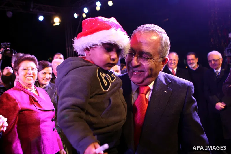 Palestinian Prime Minister, Salam Fayyad, during a ceremony of lighting the Christmas tree, in the West Bank City of Ramallah, On Dec.13, 2011. Photo by Mustafa Abu Dayeh