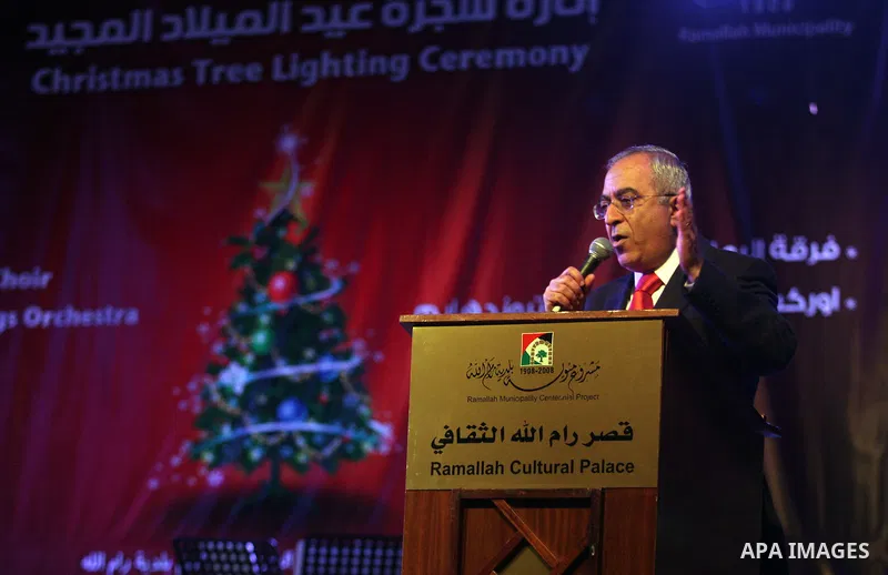 Palestinian Prime Minister, Salam Fayyad, during a ceremony of lighting the Christmas tree, in the West Bank City of Ramallah, On Dec.13, 2011. Photo by Issam Rimawi