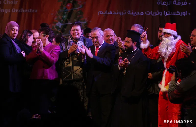 Palestinian Prime Minister, Salam Fayyad, during a ceremony of lighting the Christmas tree, in the West Bank City of Ramallah, On Dec.13, 2011. Photo by Issam Rimawi