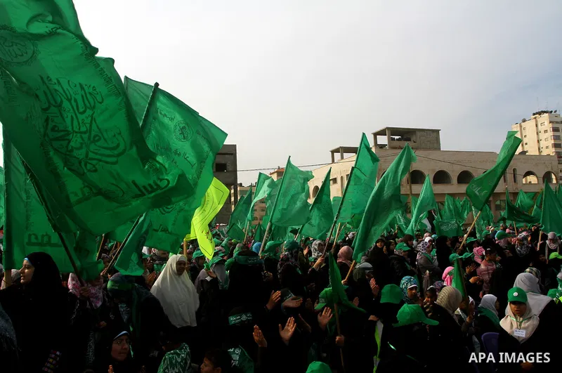 Thousands of Hamas supporters gather to celebrating marking the Islamist movement's 24nd anniversary at el-Qatiba yard in Gaza city on Dec 14, 2011. the Islamist movement of Hamas take over ruling at Gaza strip since Jun...