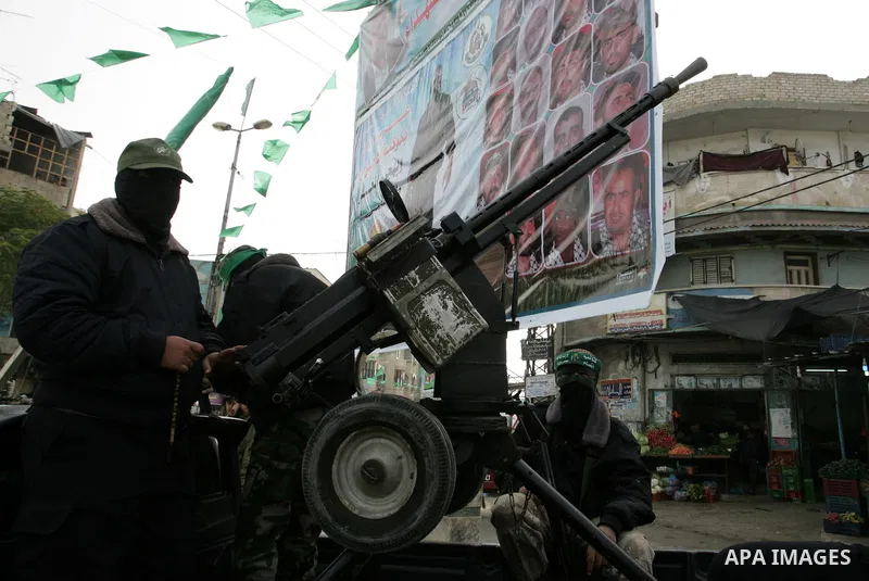 Palestinian Hamas militants patrol in the streets during the celebrations marking the Islamist movement's 24th founding anniversary, in the Rafah refugee camp in the southern Gaza Strip on December 14, 2011. Photo by Abe...