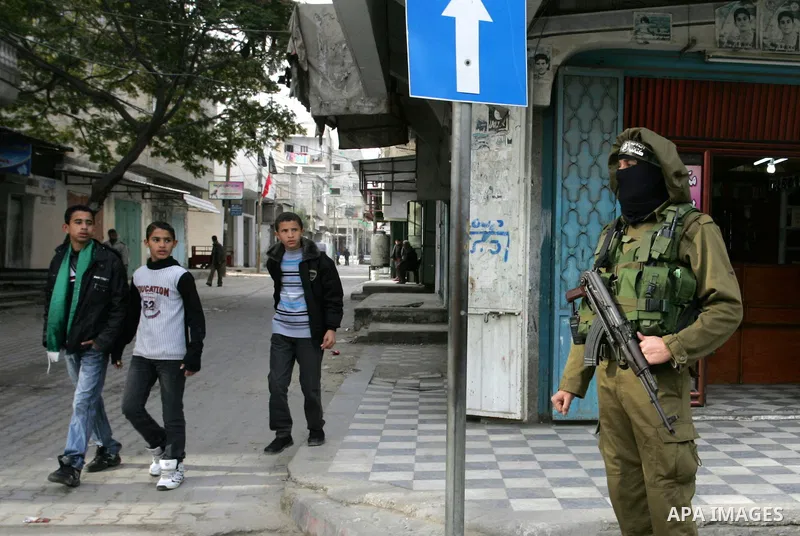 Palestinian Hamas militants patrol in the streets during the celebrations marking the Islamist movement's 24th founding anniversary, in the Rafah refugee camp in the southern Gaza Strip on December 14, 2011. Photo by Abe...