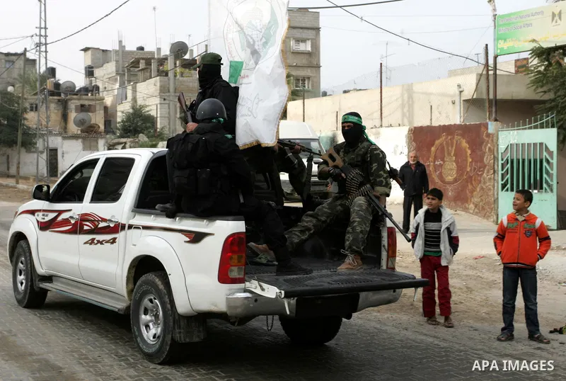 Palestinian Hamas militants patrol in the streets during the celebrations marking the Islamist movement's 24th founding anniversary, in the Rafah refugee camp in the southern Gaza Strip on December 14, 2011. Photo by Abe...