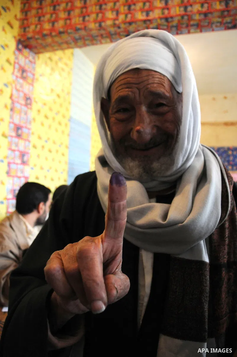 An Egyptian man shows his ink-stained finger after he voted at a polling station in Giza, southwest of Cairo, on December 14, 2011, during the second stage of Egypt's parliamentary elections. Some 18.8 million Egyptians...