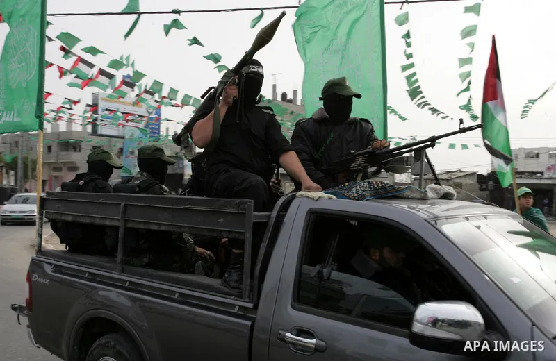 Palestinian Hamas militants patrol in the streets during the celebrations marking the Islamist movement's 24th founding anniversary, in the Rafah refugee camp in the southern Gaza Strip on December 14, 2011. Photo by Abe...