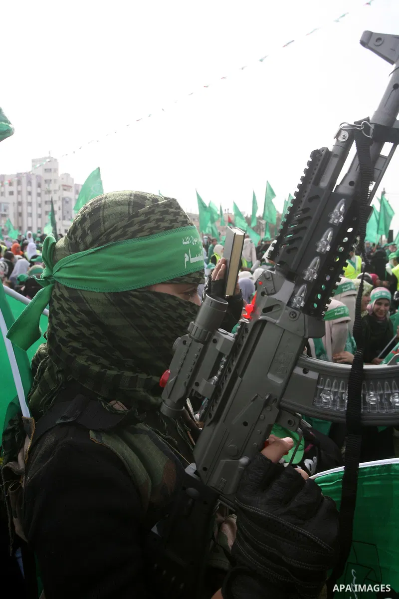 Thousands of Hamas supporters gather to celebrating marking the Islamist movement's 24nd anniversary at el-Qatiba yard in Gaza city on Dec 14, 2011. the Islamist movement of Hamas take over ruling at Gaza strip since Jun...