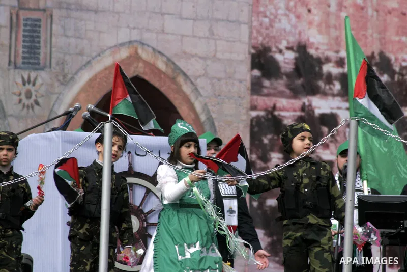 Thousands of Hamas supporters gather to celebrating marking the Islamist movement's 24nd anniversary at el-Qatiba yard in Gaza city on Dec 14, 2011. the Islamist movement of Hamas take over ruling at Gaza strip since Jun...