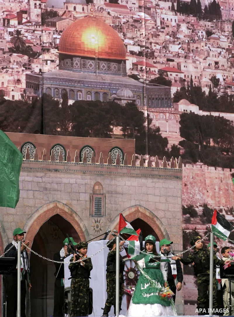 Thousands of Hamas supporters gather to celebrating marking the Islamist movement's 24nd anniversary at el-Qatiba yard in Gaza city on Dec 14, 2011. the Islamist movement of Hamas take over ruling at Gaza strip since Jun...
