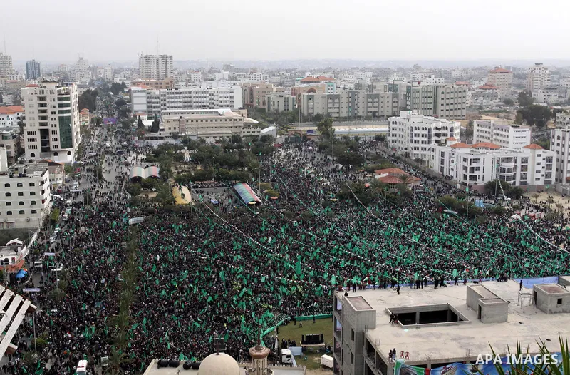 Thousands of Palestinian supporters of Hamas wave the Islamist movement's flags during celebrations for the 24th anniversary of its foundation in Gaza City on December 14, 2011. Photo by Mohammed Asad