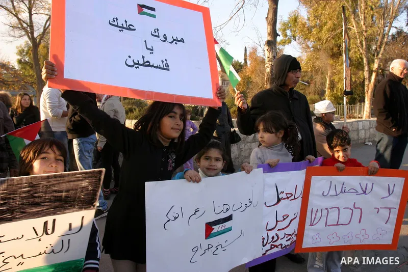 Demonstrators take part in a protest against a Jewish settlement in the Sheikh Jarrah neighborhood in East Jerusalem on Dec. 16, 2011. Photo by Mahfouz Abu Turk