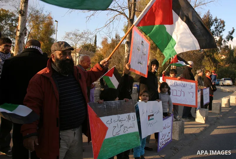 Demonstrators take part in a protest against a Jewish settlement in the Sheikh Jarrah neighborhood in East Jerusalem on Dec. 16, 2011. Photo by Mahfouz Abu Turk