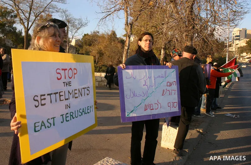Demonstrators take part in a protest against a Jewish settlement in the Sheikh Jarrah neighborhood in East Jerusalem on Dec. 16, 2011. Photo by Mahfouz Abu Turk