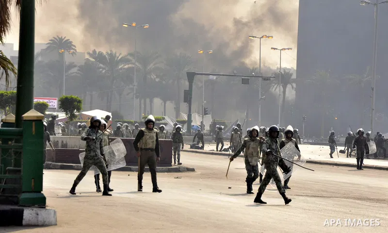 Egyptian riot policemen run towards demonstrators during clashes in the administrative heart of Cairo on December 17, 2011. Fresh clashes erupted between protesters and security forces for the second day in a row, killin...