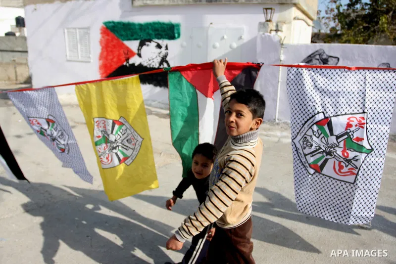 Palestinian relatives of prisoner Younis Jahjouh decorate the street ahead of his release from Israeli prisons in the Qalandia refugee camp near the West Bank city of Ramallah, Saturday, Dec 17, 2011. Israel is set to re...