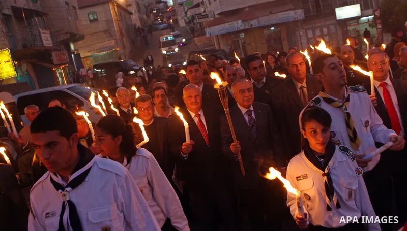 Palestinian Prime Minister Salam Fayyad attends the Christmas tree lighting celebration in the West Bank town of Beit Shour, near Bethlehem, on Dec. 17, 2011. Photo by Mustafa Abu Dayeh