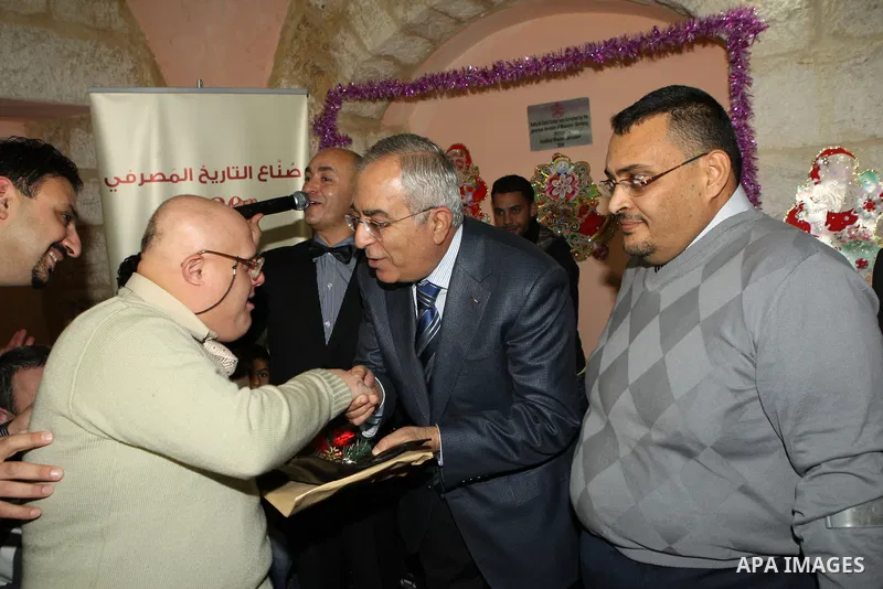 Palestinian Prime Minister Salam Fayyad attends the Christmas tree lighting celebration in the West Bank town of Beit Shour, near Bethlehem, on Dec. 17, 2011. Photo by Mustafa Abu Dayeh