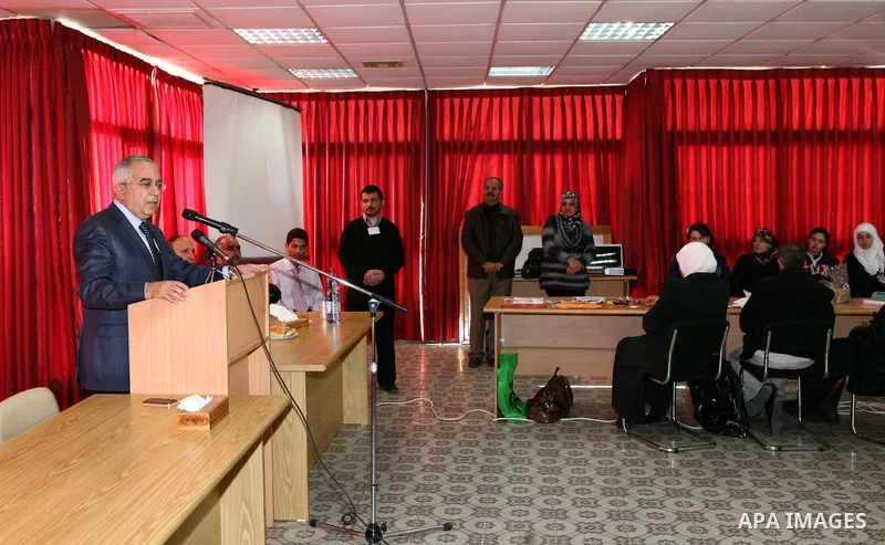 Palestinian Prime Minister Salam Fayyad visits the exhibition organized by Noor Al Ain "the light of eye" Association for the blind and visually impaired in the West Bank city of Ramallah on Dec. 18, 2011. Photo by Musta...