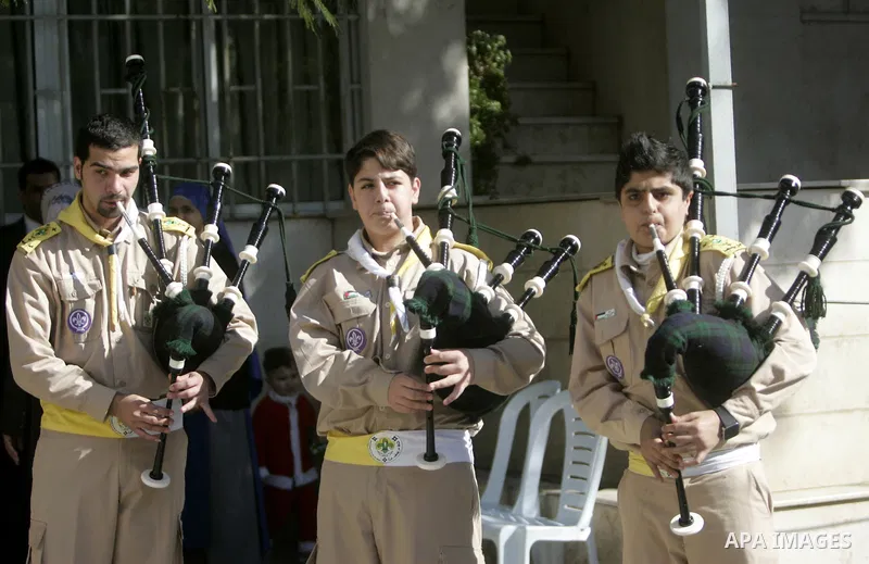 Christian scouts stand as Latin Patriarch of Jerusalem Fouad Twal arrives at at Deir al-Laten Church in Gaza City December 18, 2011, to attend a celebration with Palestinians ahead of Christmas. Photo by Yasser Fathi
