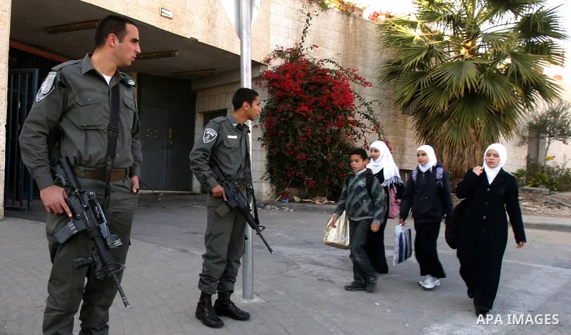 Palestinians, Israelis and foreign activists take part in a protest to show solidarity with Palestinian families against a Jewish settlement in Ras El Amoud neighbourhood in East Jerusalem on Dec 20, 2011. Photo by Mahfo...