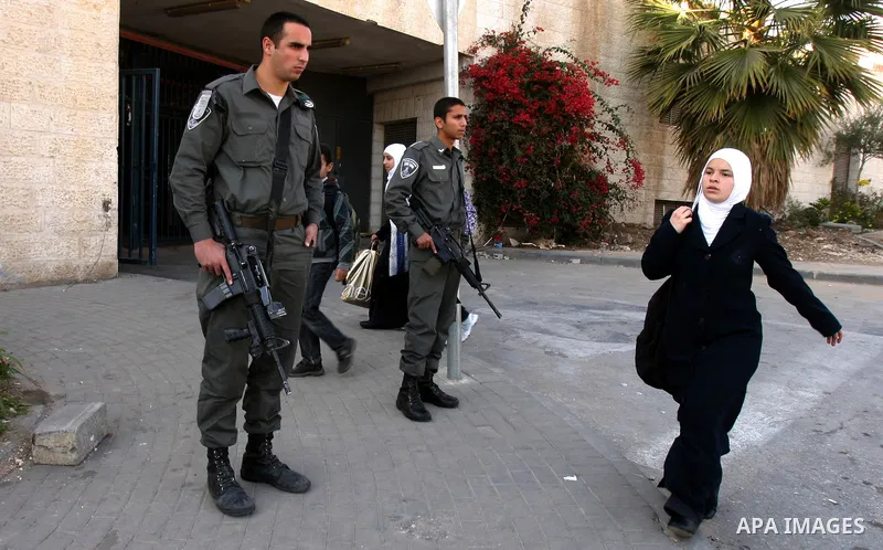 Palestinians, Israelis and foreign activists take part in a protest to show solidarity with Palestinian families against a Jewish settlement in Ras El Amoud neighbourhood in East Jerusalem on Dec 20, 2011. Photo by Mahfo...