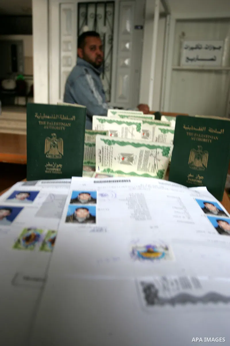 Palestinian employees working in a the Ministry of the Interior Department of Passports and visas for travel in Rafah, southern Gaza Strip December 21, 2011. Hamas spokesman Fawzi Barhoum,said that " he discussed the pro...