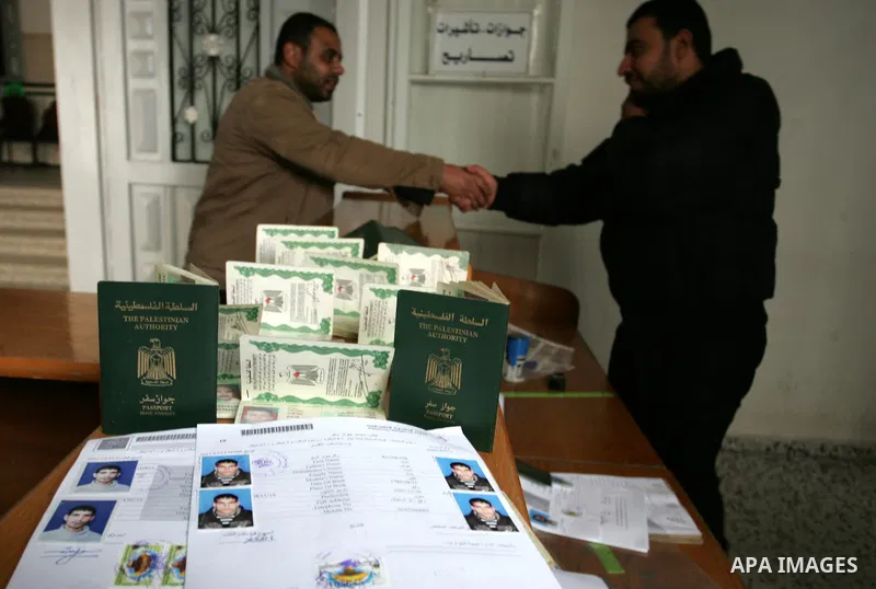 Palestinian employees working in a the Ministry of the Interior Department of Passports and visas for travel in Rafah, southern Gaza Strip December 21, 2011. Hamas spokesman Fawzi Barhoum,said that " he discussed the pro...