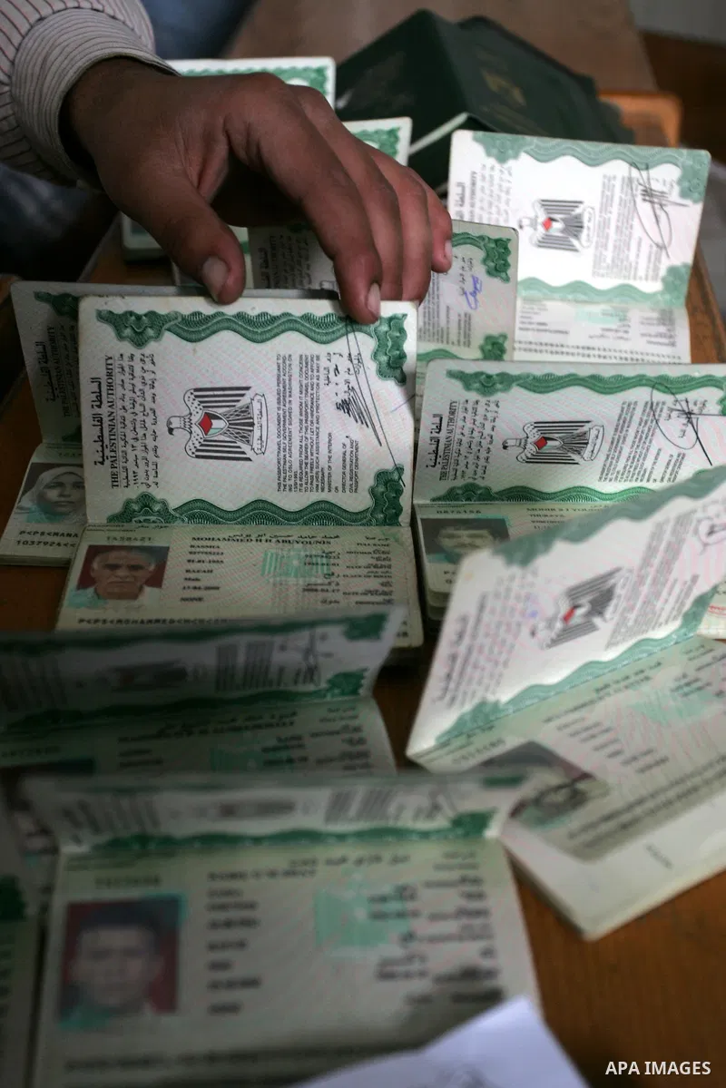 Palestinian employees working in a the Ministry of the Interior Department of Passports and visas for travel in Rafah, southern Gaza Strip December 21, 2011. Hamas spokesman Fawzi Barhoum,said that " he discussed the pro...