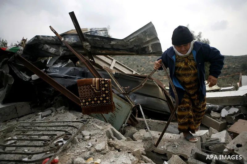 Palestinians inspect a house which was demolished by Israeli army in the occupied West Bank city of Nablus on December 21, 2011. Photo by Wagdi Eshtayah.