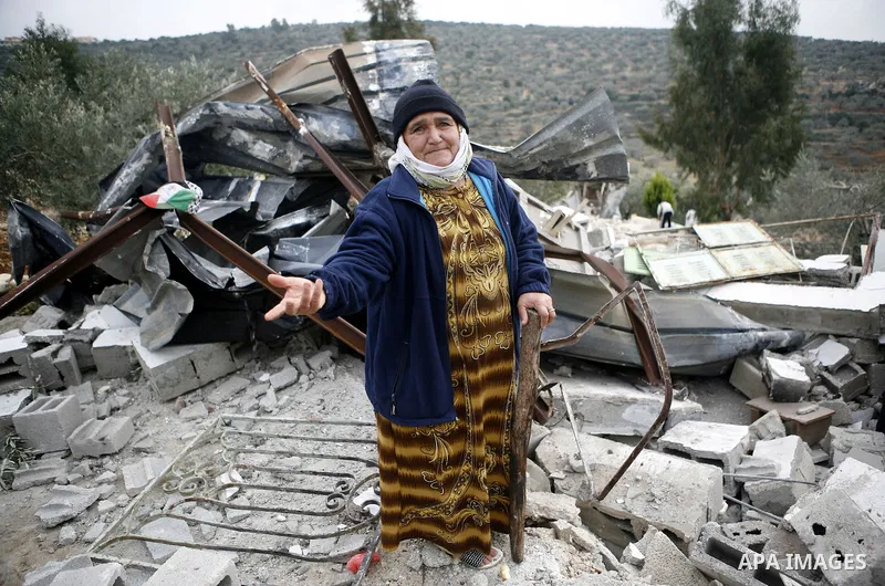 Palestinians inspect a house which was demolished by Israeli army in the occupied West Bank city of Nablus on December 21, 2011. Photo by Wagdi Eshtayah.